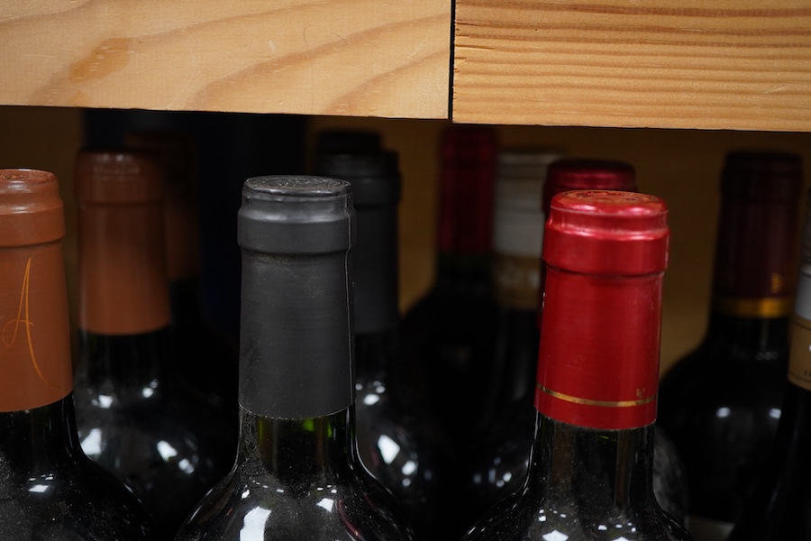 A bottle of Chateau Haut-Bages Liberal, 2001, and thirteen other bottles of red wine